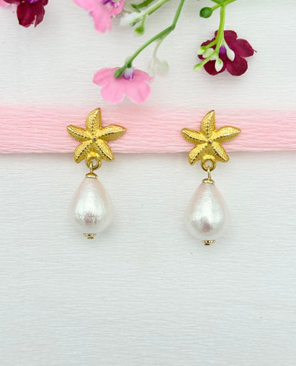 Seestern-Clips in Gold mit leichtem Baumwoll-Tropfen